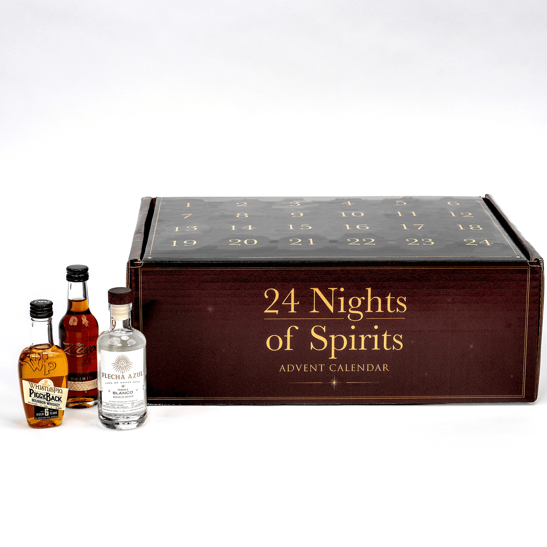 An advent calendarlabeled '24 Nights of Spirits Advent Calendar' in gold lettering on a dark wood-toned front, shown with three miniature spirit bottles in front on a clean white studio background.